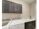 Laundry room with washer, dryer, and cabinets at 4133 Golden Creek Ter, Parrish, FL 34219