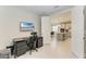 Home office with a desk, chair, and view into kitchen at 4133 Golden Creek Ter, Parrish, FL 34219