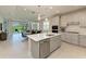 Open concept kitchen with island, stainless steel appliances, and view of living room at 4133 Golden Creek Ter, Parrish, FL 34219