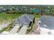 Aerial view of community with homes and a pond at 4133 Golden Creek Ter, Parrish, FL 34219