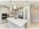Modern kitchen with stainless steel appliances and white quartz countertops at 4133 Golden Creek Ter, Parrish, FL 34219