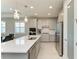 Modern kitchen with stainless steel appliances and white quartz countertops at 4133 Golden Creek Ter, Parrish, FL 34219