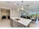 Open concept kitchen with island and stainless steel appliances at 4133 Golden Creek Ter, Parrish, FL 34219