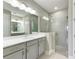 Elegant bathroom with a large walk-in shower and double vanity at 4133 Golden Creek Ter, Parrish, FL 34219