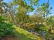 Peaceful waterfront view with lush vegetation along the canal at 6417 Meadowlark Ln # 6417, Bradenton, FL 34210