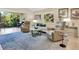 Living room with comfortable seating and a view to the backyard at 6417 Meadowlark Ln # 6417, Bradenton, FL 34210