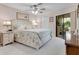 Spacious main bedroom with plush bedding and ensuite bathroom at 6417 Meadowlark Ln # 6417, Bradenton, FL 34210