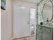 Bright entryway with a white door and green console table at 6417 Meadowlark Ln # 6417, Bradenton, FL 34210