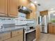 Kitchen boasts stainless steel appliances and light wood cabinetry at 6417 Meadowlark Ln # 6417, Bradenton, FL 34210