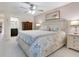 Bright main bedroom with king-size bed and access to bathroom at 6417 Meadowlark Ln # 6417, Bradenton, FL 34210