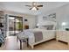 Main bedroom with king-size bed and sliding glass doors to patio at 6417 Meadowlark Ln # 6417, Bradenton, FL 34210