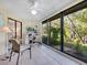 Bright sunroom with sliding glass doors, offering tranquil garden views at 6417 Meadowlark Ln # 6417, Bradenton, FL 34210