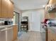 Galley kitchen with stainless steel appliances and wood cabinets at 6417 Meadowlark Ln # 6417, Bradenton, FL 34210