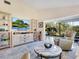 Living room with large TV, comfortable seating and backyard view at 6417 Meadowlark Ln # 6417, Bradenton, FL 34210
