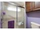 Bathroom with shower stall, toilet and wood cabinets at 4966 Clubview E Ct, Bradenton, FL 34203