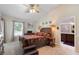 Main bedroom with a queen-size bed, carpet flooring, and ceiling fan at 4966 Clubview E Ct, Bradenton, FL 34203