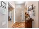 Bright and spacious entryway with wood flooring and a wooden console table at 4966 Clubview E Ct, Bradenton, FL 34203