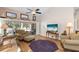 Bright living room with hardwood floors, comfortable seating, and sliding glass doors at 4966 Clubview E Ct, Bradenton, FL 34203