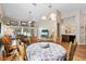 Bright dining area with a round table, four chairs, and hardwood floors at 4966 Clubview E Ct, Bradenton, FL 34203