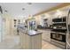 Updated kitchen with granite island and stainless steel appliances at 4966 Clubview E Ct, Bradenton, FL 34203