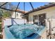 Relaxing hot tub with screened enclosure at 4966 Clubview E Ct, Bradenton, FL 34203