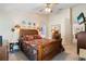 Spacious bedroom with a wooden bed frame and carpeted floors at 4966 Clubview E Ct, Bradenton, FL 34203