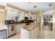 Modern kitchen with granite countertops and stainless steel appliances at 4966 Clubview E Ct, Bradenton, FL 34203