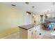 Kitchen with granite island and view into laundry room at 4966 Clubview E Ct, Bradenton, FL 34203