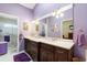 Double vanity bathroom with a large mirror and shower at 4966 Clubview E Ct, Bradenton, FL 34203