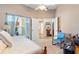 Bright bedroom with a wooden bed frame and sitting area at 4966 Clubview E Ct, Bradenton, FL 34203