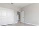 Spacious bedroom with double doors and neutral color palette at 3371 Gowanda Ave, North Port, FL 34287