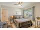 Well-lit bedroom featuring a queen bed and a sofa at 2607 Riverbluff Pkwy # V145, Sarasota, FL 34231