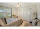 Cozy bedroom with a comfortable bed and seating area at 2607 Riverbluff Pkwy # V145, Sarasota, FL 34231
