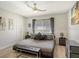 Main bedroom with king-size bed and gray accents at 2607 Riverbluff Pkwy # V145, Sarasota, FL 34231