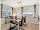 Modern dining room with glass table and gray chairs at 2607 Riverbluff Pkwy # V145, Sarasota, FL 34231