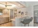 Updated kitchen with light cabinets and stainless steel appliances at 2607 Riverbluff Pkwy # V145, Sarasota, FL 34231