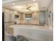 Modern kitchen boasting stainless steel appliances and light wood cabinets at 2607 Riverbluff Pkwy # V145, Sarasota, FL 34231