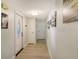 Hallway with light walls and wood-look flooring at 2607 Riverbluff Pkwy # V145, Sarasota, FL 34231