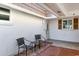 Front entry with two chairs and tile flooring at 2607 Riverbluff Pkwy # V145, Sarasota, FL 34231