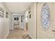 Bright and airy entry hallway with light wood floors at 2607 Riverbluff Pkwy # V145, Sarasota, FL 34231