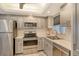 Well-equipped kitchen featuring stainless steel appliances at 2607 Riverbluff Pkwy # V145, Sarasota, FL 34231