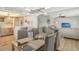 Open concept dining area with kitchen view at 2607 Riverbluff Pkwy # V145, Sarasota, FL 34231