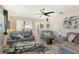 Spacious living room featuring gray sofas and hardwood floors at 2607 Riverbluff Pkwy # V145, Sarasota, FL 34231