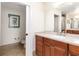 Main bathroom with updated vanity and toilet at 611 Riviera Dunes Way # 104, Palmetto, FL 34221