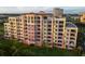 Condo building featuring balconies and beautiful water views at 611 Riviera Dunes Way # 104, Palmetto, FL 34221