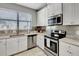 Modern kitchen featuring stainless steel appliances and granite countertops at 228 Crew Ct, Sarasota, FL 34243