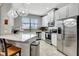 Modern kitchen with stainless steel appliances and granite countertops at 228 Crew Ct, Sarasota, FL 34243