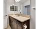 Bathroom boasts a vanity with granite countertop at 228 Crew Ct, Sarasota, FL 34243
