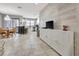 Open living space with wood-look floors and built-in entertainment center at 228 Crew Ct, Sarasota, FL 34243