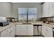 Modern kitchen with stainless steel appliances and granite countertops at 228 Crew Ct, Sarasota, FL 34243